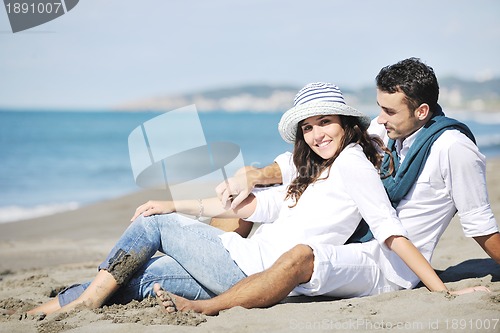 Image of happy young couple have fun at beautiful beach