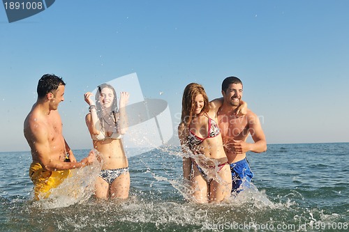 Image of happy young  people group have fun on beach