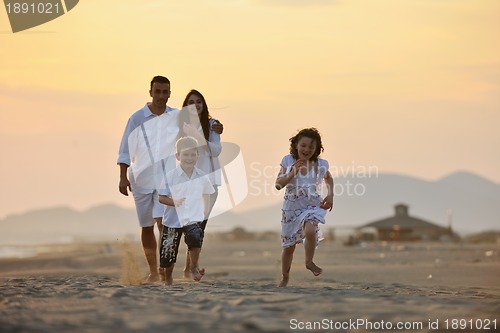 Image of happy young family have fun on beach