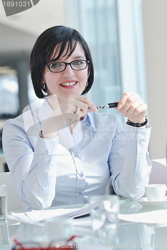 Image of young business woman on meeting