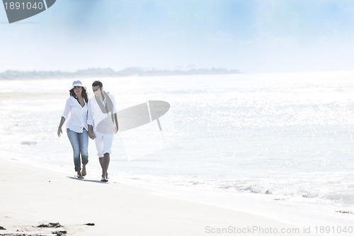 Image of happy young couple have fun at beautiful beach