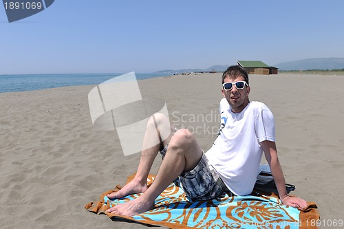 Image of man relax on beach