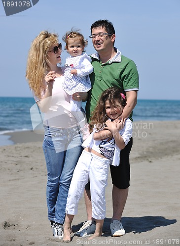 Image of happy young family have fun on beach