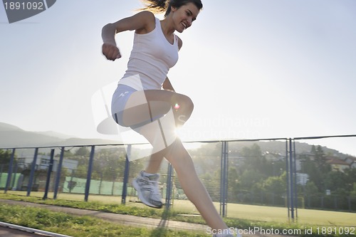 Image of woman jogging at early morning 