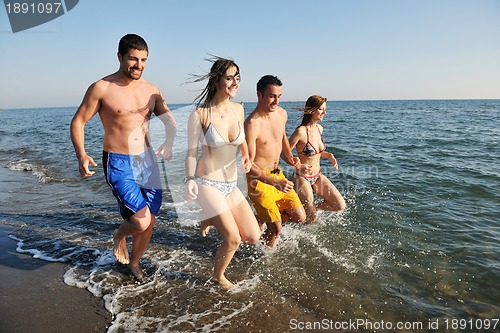 Image of happy young  people group have fun on beach
