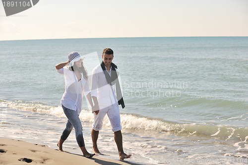 Image of happy young couple have fun at beautiful beach