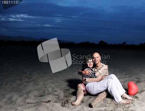 Image of happy young couple have fun on beach