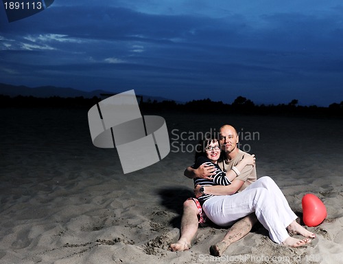 Image of happy young couple have fun on beach