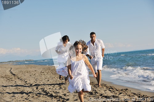 Image of happy young  family have fun on beach