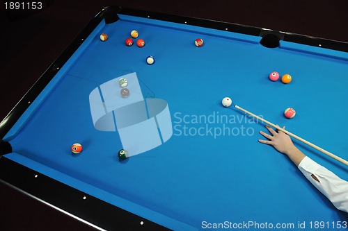 Image of young man play pro billiard game 