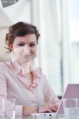 Image of young business woman on meeting