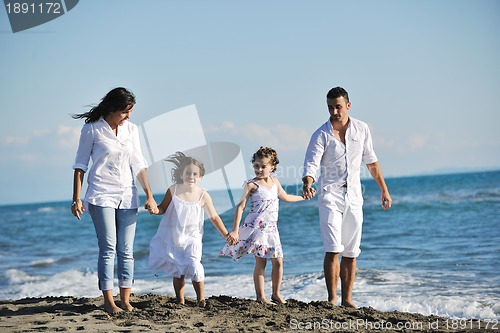 Image of happy young  family have fun on beach