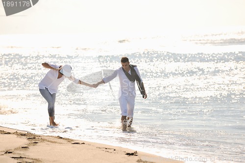 Image of happy young couple have fun at beautiful beach