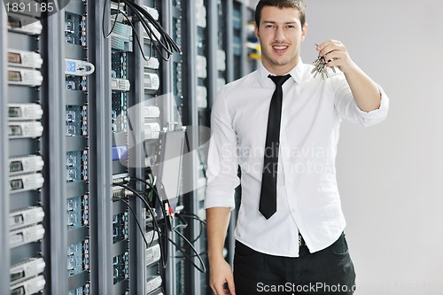 Image of young it engeneer in datacenter server room