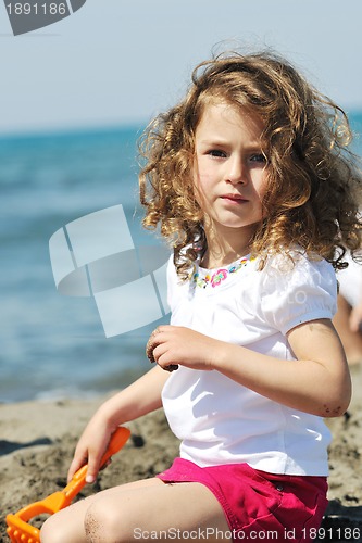 Image of little female  child portrait on the beach