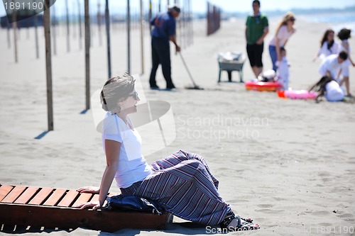 Image of young woman relax  on beach