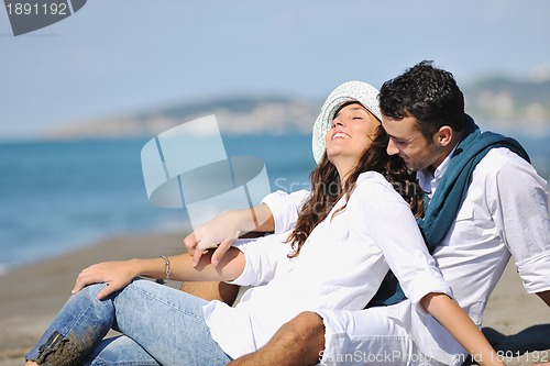 Image of happy young couple have fun at beautiful beach