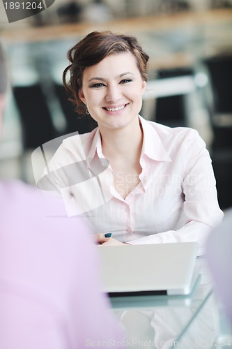 Image of young business woman on meeting