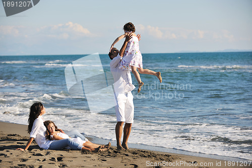 Image of happy young  family have fun on beach