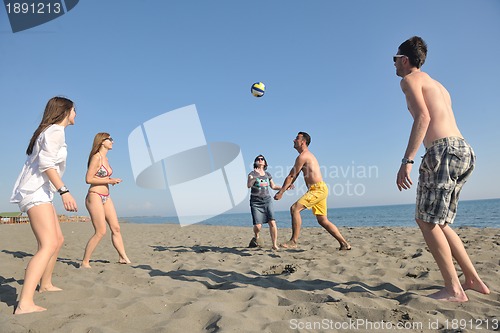 Image of young people group have fun and play beach volleyball