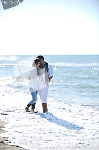 Image of happy young couple have fun at beautiful beach
