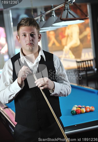 Image of young man play pro billiard game 