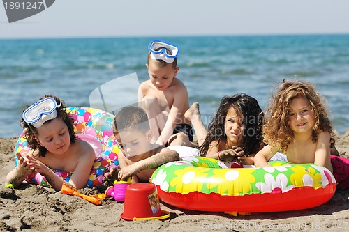 Image of child group have fun and play with beach toys