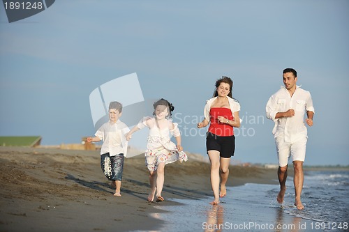 Image of happy young family have fun on beach