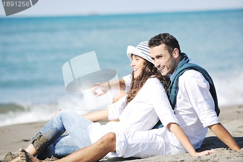 Image of happy young couple have fun at beautiful beach