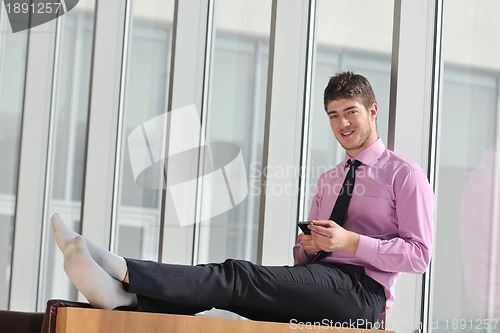 Image of young business man talk by cellphone