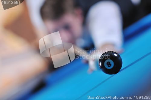 Image of young man play pro billiard game 