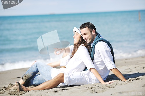 Image of happy young couple have fun at beautiful beach