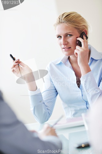 Image of young business woman on meeting