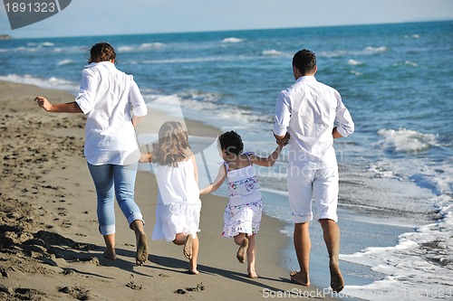 Image of happy young  family have fun on beach