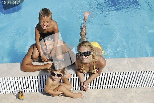 Image of happy young family have fun on swimming pool