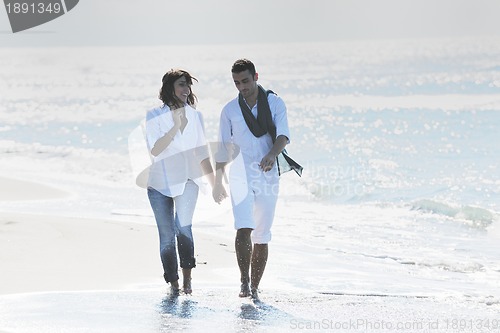 Image of happy young couple have fun at beautiful beach