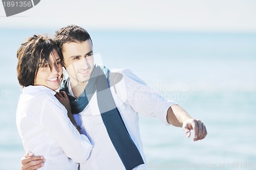 Image of happy young couple have fun at beautiful beach