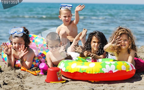 Image of child group have fun and play with beach toys