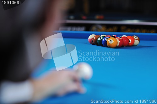 Image of young man play pro billiard game 