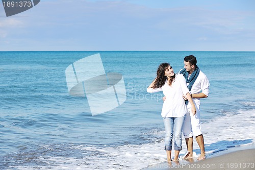 Image of happy young couple have fun at beautiful beach