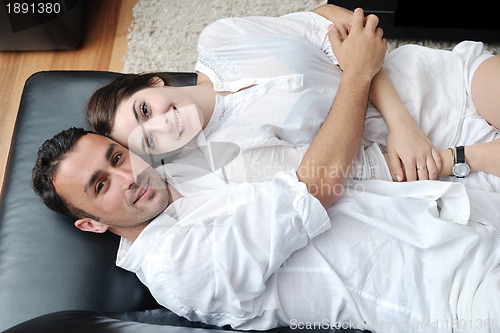 Image of happy young couple relax at home