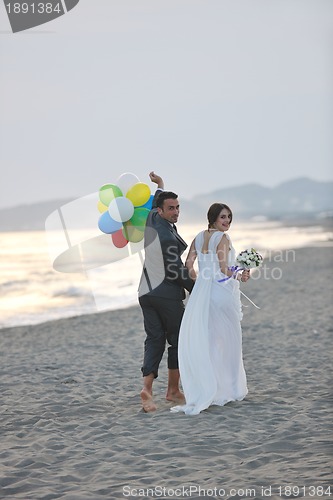 Image of romantic beach wedding at sunset