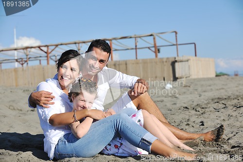 Image of happy young  family have fun on beach