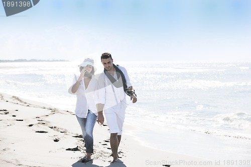 Image of happy young couple have fun at beautiful beach