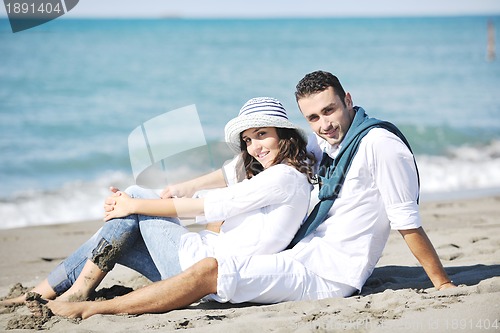 Image of happy young couple have fun at beautiful beach