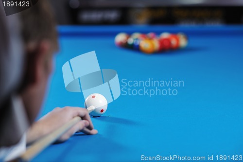 Image of young man play pro billiard game 