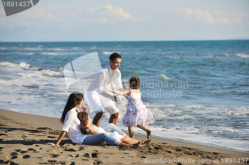 Image of happy young  family have fun on beach