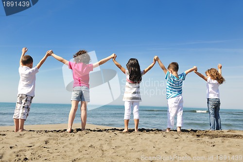 Image of happy young  people group have fun on beach