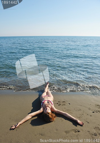 Image of young woman relax  on beach