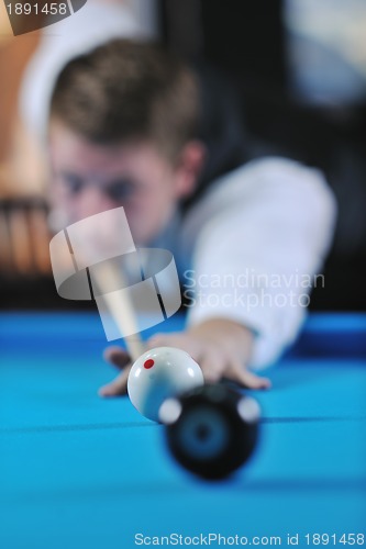 Image of young man play pro billiard game 